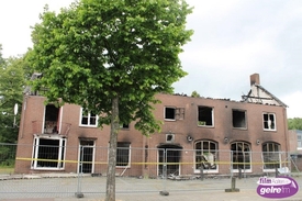 Uitgebrand pand Chinees wordt gesloopt.
